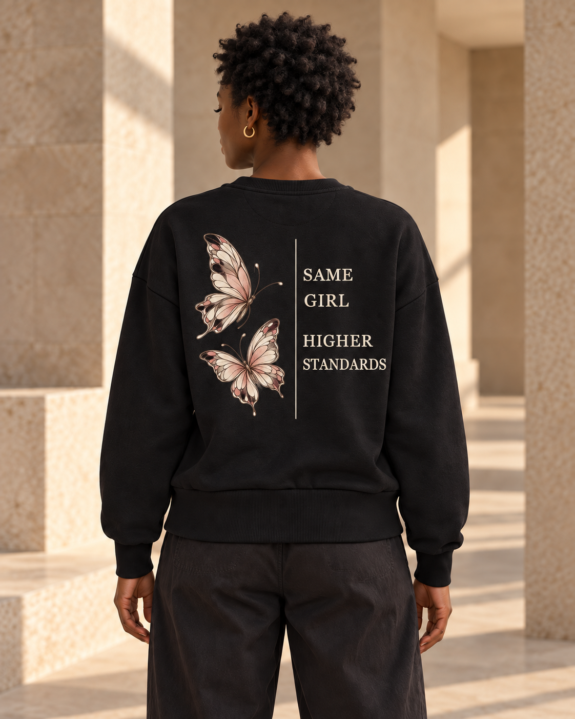 Digital design visualization of a woman wearing CALLED FORM Higher Standards Crewneck in Black, showing the back artwork.